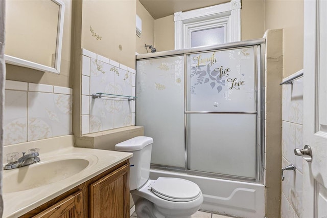 5029 Wells Ave, Saint Louis, MO 63113 - bathroom with vanity, shower / bath combination with glass door, and toilet