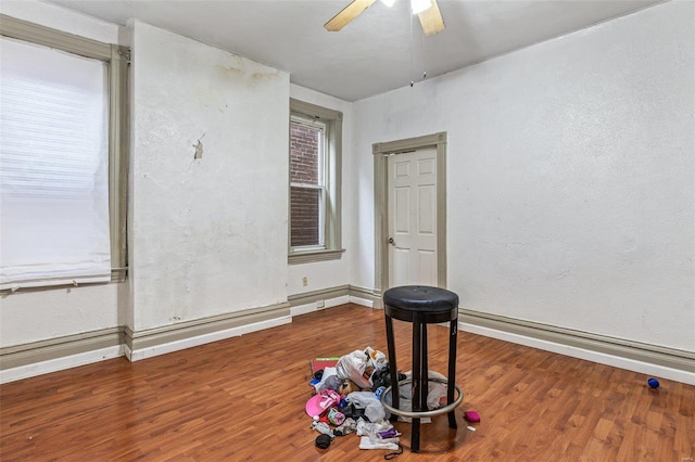 5029 Wells Ave, Saint Louis, MO 63113 - empty room featuring ceiling fan, wood finished floors, baseboards, and a textured wall