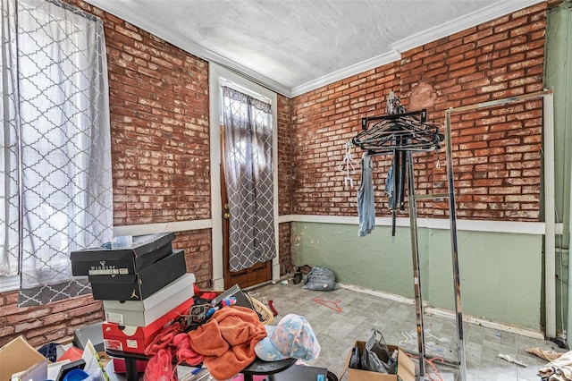 5029 Wells Ave, Saint Louis, MO 63113 - unfurnished room with ornamental molding, baseboards, a textured ceiling, and brick wall