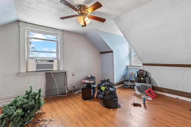 5029 Wells Ave, Saint Louis, MO 63113 - bonus room with cooling unit, a textured ceiling, wood-type flooring, vaulted ceiling, and ceiling fan