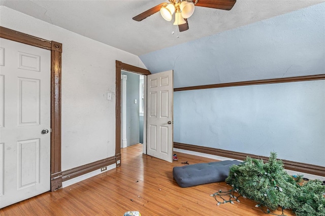 5029 Wells Ave, Saint Louis, MO 63113 - bedroom with lofted ceiling, wood finished floors, baseboards, and ceiling fan