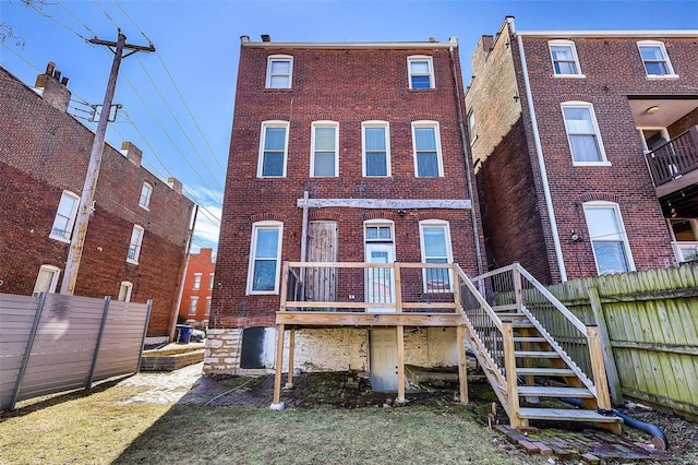 1317 Shenandoah Ave, Saint Louis, MO 63104 - back of house with brick siding, fence, and stairway