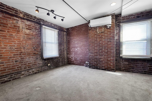 1317 Shenandoah Ave, Saint Louis, MO 63104 - spare room with brick wall, carpet flooring, and a wall unit AC