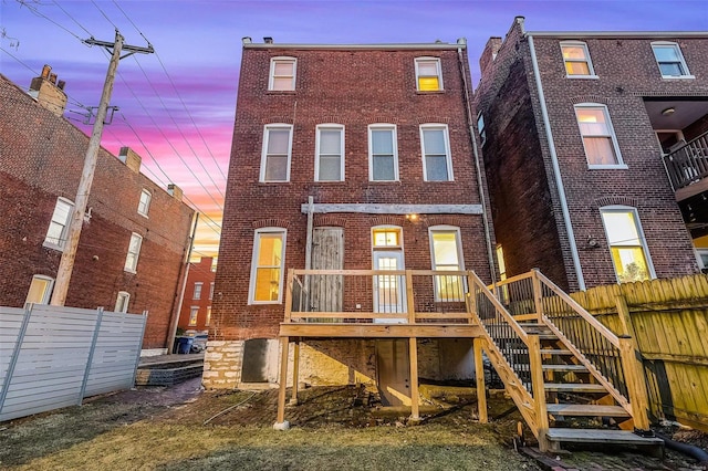 1317 Shenandoah Ave, Saint Louis, MO 63104 - rear view of property with brick siding, fence, and a deck