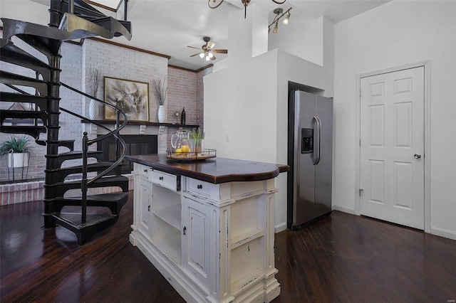 1317 Shenandoah Ave, Saint Louis, MO 63104 - kitchen with stainless steel refrigerator with ice dispenser, dark wood finished floors, wood counters, ceiling fan, and open shelves