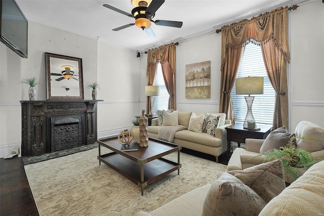 1317 Shenandoah Ave, Saint Louis, MO 63104 - living area featuring a ceiling fan, wood finished floors, crown molding, and a fireplace with flush hearth