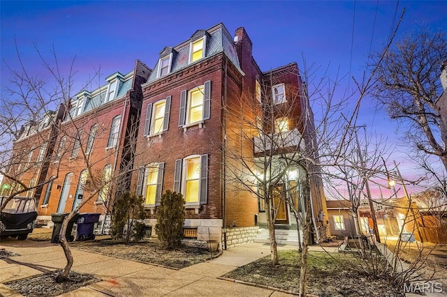 1317 Shenandoah Ave, Saint Louis, MO 63104 - view of side of home featuring brick siding and mansard roof