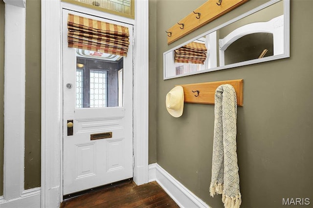 1317 Shenandoah Ave, Saint Louis, MO 63104 - doorway with dark wood-style floors and baseboards