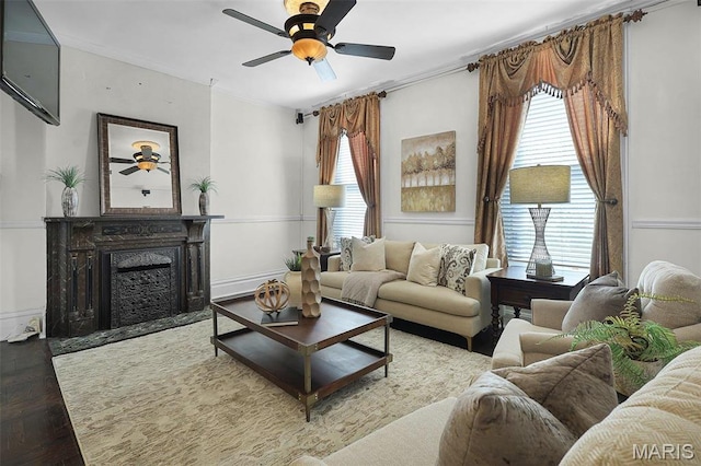 1317 Shenandoah Ave, Saint Louis, MO 63104 - living room with a ceiling fan, crown molding, a fireplace with flush hearth, and wood finished floors