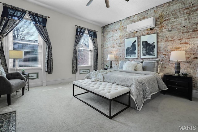 1317 Shenandoah Ave, Saint Louis, MO 63104 - bedroom with a wall unit AC, an accent wall, carpet flooring, brick wall, and a ceiling fan