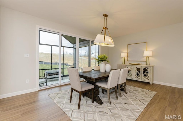 212 Terradel Trl, Foristell, MO 63348 - dining area with baseboards and light wood-style flooring