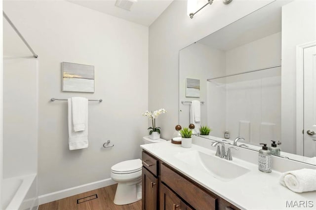 212 Terradel Trl, Foristell, MO 63348 - full bath featuring wood finished floors, vanity, baseboards, toilet, and shower / washtub combination