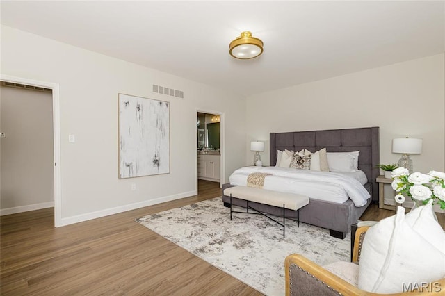 212 Terradel Trl, Foristell, MO 63348 - bedroom with wood finished floors, baseboards, and ensuite bathroom