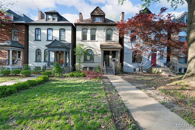 view of property with a front lawn