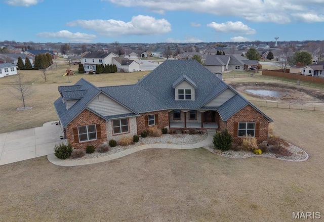 9606 Klings Ct, Mascoutah, IL 62258 - view of front of property featuring covered porch, brick siding, a residential view, and driveway