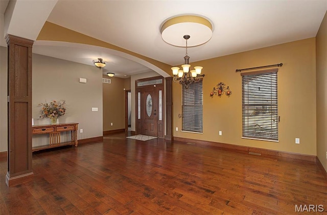 9606 Klings Ct, Mascoutah, IL 62258 - foyer with hardwood / wood-style floors, arched walkways, baseboards, a chandelier, and decorative columns