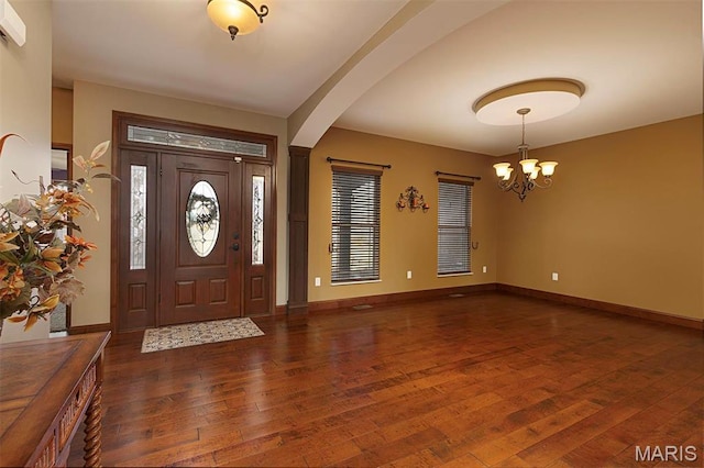9606 Klings Ct, Mascoutah, IL 62258 - entrance foyer with a chandelier, hardwood / wood-style floors, arched walkways, and baseboards