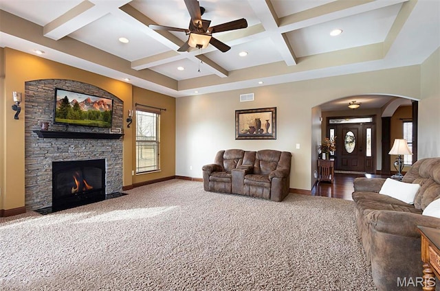 9606 Klings Ct, Mascoutah, IL 62258 - living room featuring coffered ceiling, carpet floors, baseboards, ceiling fan, and arched walkways
