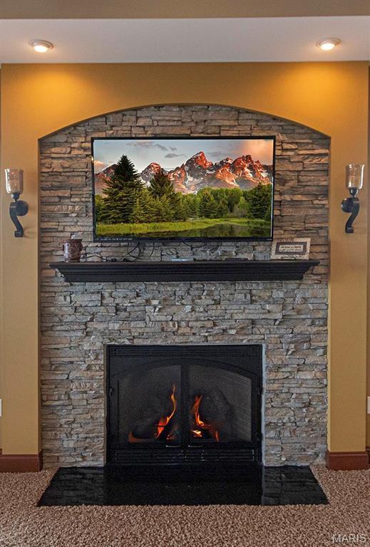 9606 Klings Ct, Mascoutah, IL 62258 - detailed view of a fireplace, carpet floors, and baseboards