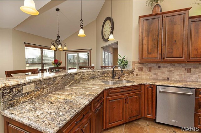 9606 Klings Ct, Mascoutah, IL 62258 - kitchen featuring stainless steel dishwasher, a sink, a chandelier, light stone countertops, and high vaulted ceiling