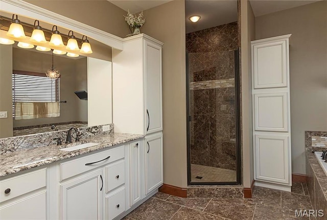 9606 Klings Ct, Mascoutah, IL 62258 - full bathroom with baseboards, a shower stall, a garden tub, and vanity