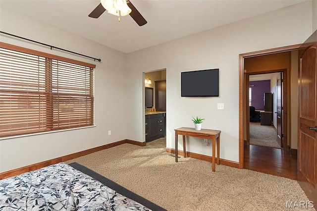 9606 Klings Ct, Mascoutah, IL 62258 - carpeted bedroom with baseboards, connected bathroom, and ceiling fan