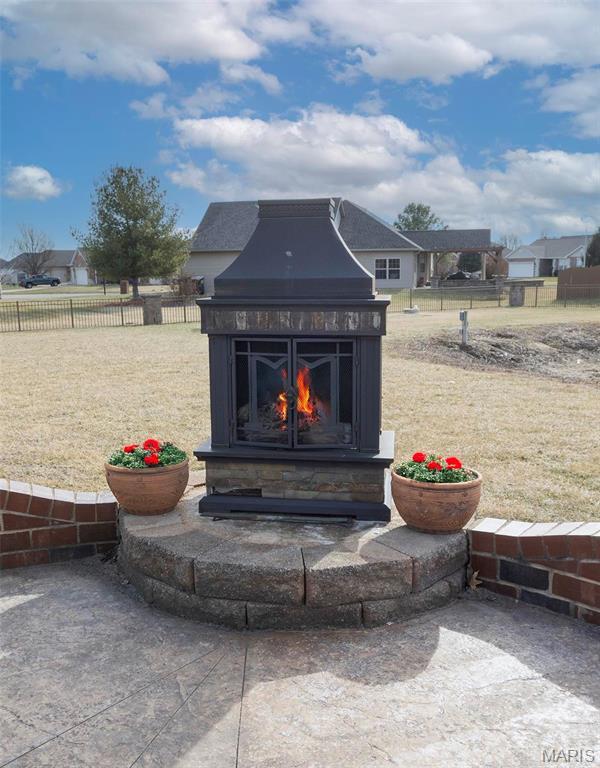 9606 Klings Ct, Mascoutah, IL 62258 - detailed view of a warm lit fireplace