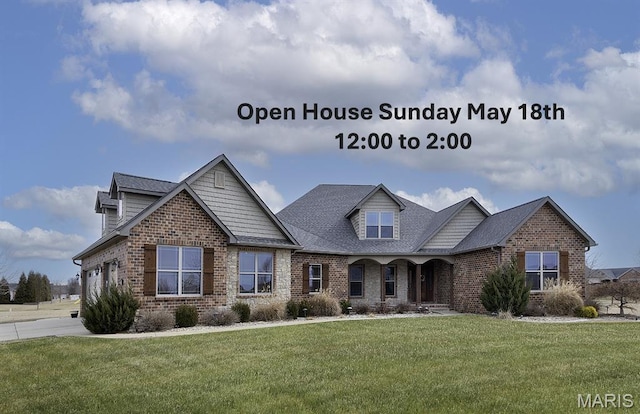 9606 Klings Ct, Mascoutah, IL 62258 - craftsman-style home with brick siding, a front yard, an attached garage, roof with shingles, and a porch