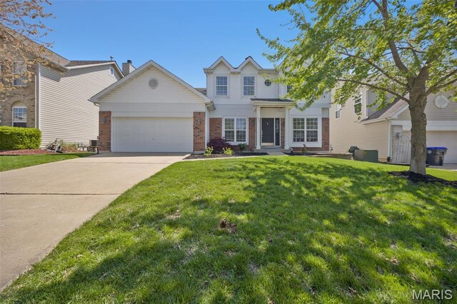 1218 Cold Spring Dr, Ofallon, MO 63368 - traditional-style home with brick siding, an attached garage, driveway, and a front lawn