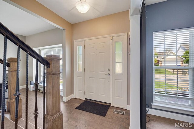 1218 Cold Spring Dr, Ofallon, MO 63368 - foyer entrance with wood finished floors, baseboards, and stairway