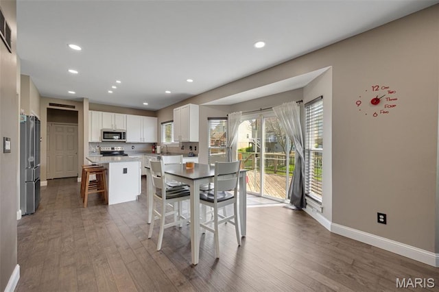 1218 Cold Spring Dr, Ofallon, MO 63368 - dining room with baseboards, wood finished floors, and recessed lighting