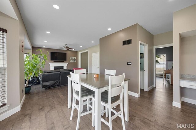 1218 Cold Spring Dr, Ofallon, MO 63368 - dining area featuring a ceiling fan, a fireplace, wood finished floors, baseboards, and recessed lighting