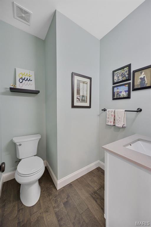 1218 Cold Spring Dr, Ofallon, MO 63368 - bathroom with wood finished floors, toilet, vanity, and baseboards
