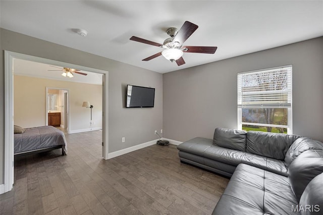 1218 Cold Spring Dr, Ofallon, MO 63368 - living room featuring ceiling fan, wood finished floors, and baseboards