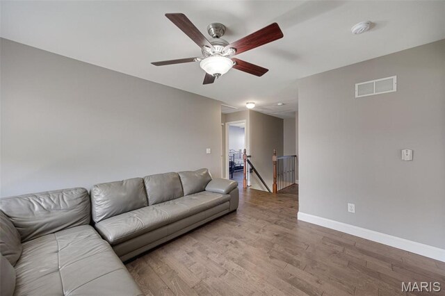 1218 Cold Spring Dr, Ofallon, MO 63368 - living room featuring wood finished floors, baseboards, and a ceiling fan