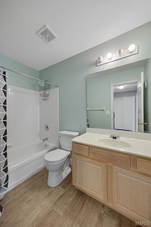 1218 Cold Spring Dr, Ofallon, MO 63368 - bathroom with wood finished floors, shower / bath combo, vanity, and toilet