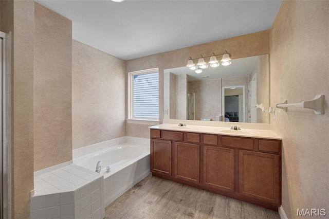 1218 Cold Spring Dr, Ofallon, MO 63368 - full bath with a bath, wood finished floors, double vanity, and a shower