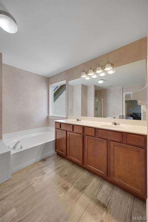 1218 Cold Spring Dr, Ofallon, MO 63368 - full bath with wood finished floors, a bath, double vanity, and a shower with door