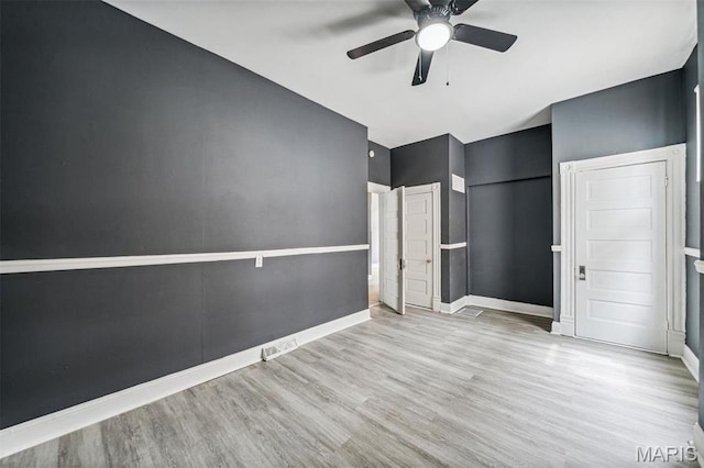 4649 Louisiana Ave, Saint Louis, MO 63111 - unfurnished bedroom featuring wood finished floors, baseboards, and a ceiling fan