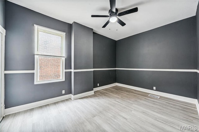 4649 Louisiana Ave, Saint Louis, MO 63111 - empty room with wood finished floors, a ceiling fan, and baseboards