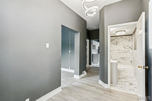 4649 Louisiana Ave, Saint Louis, MO 63111 - hallway with a chandelier and baseboards