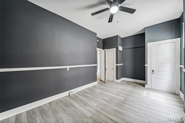 4649 Louisiana Ave, Saint Louis, MO 63111 - unfurnished bedroom with wood finished floors, baseboards, and a ceiling fan