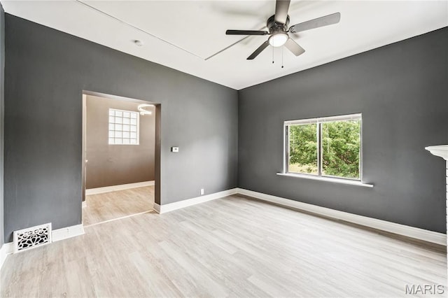 4649 Louisiana Ave, Saint Louis, MO 63111 - spare room featuring ceiling fan, wood finished floors, baseboards, and attic access