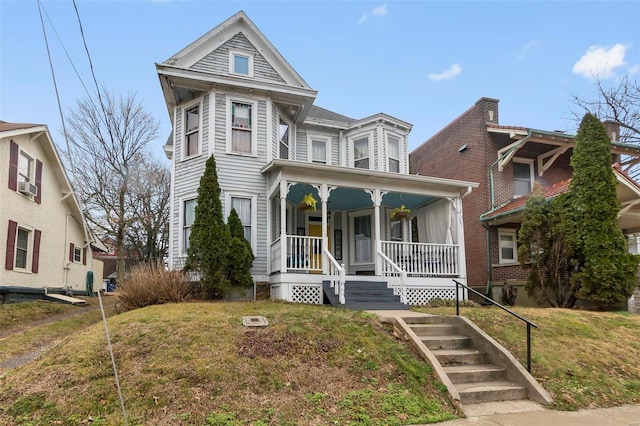 34 N Fountain Cpe, Girardeau, MO 63701 - victorian-style house with a porch, cooling unit, and a front lawn