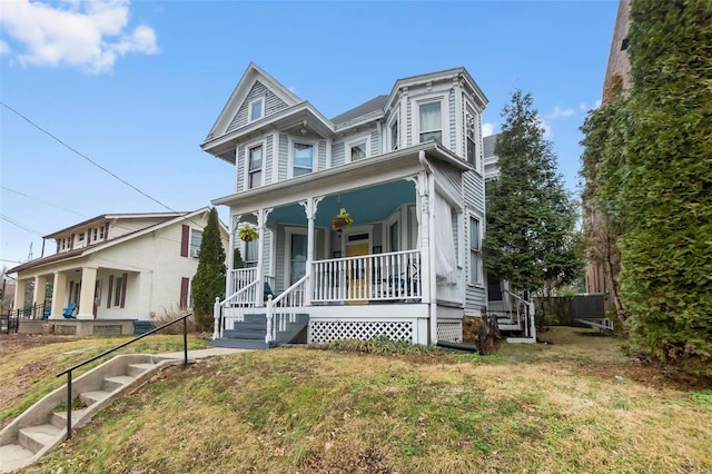 34 N Fountain Cpe, Girardeau, MO 63701 - view of front of house featuring a porch, a front lawn, and stairway