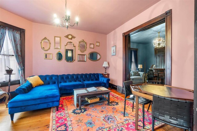 34 N Fountain Cpe, Girardeau, MO 63701 - living area featuring a chandelier and wood finished floors