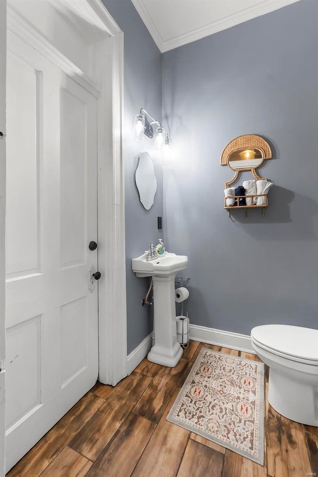 34 N Fountain Cpe, Girardeau, MO 63701 - half bath with ornamental molding, baseboards, toilet, and wood finished floors