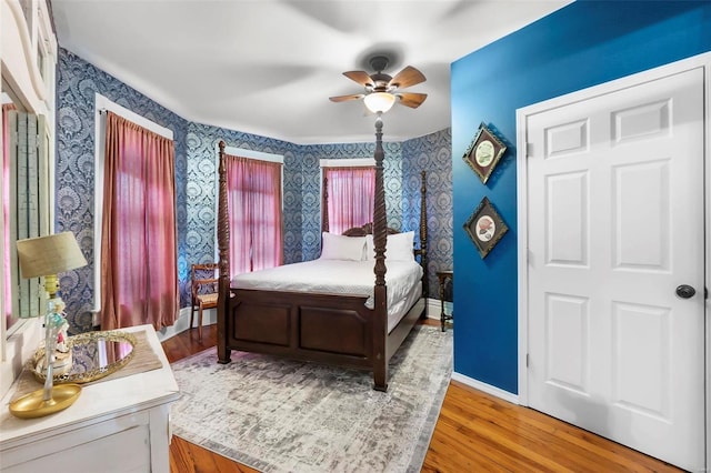 34 N Fountain Cpe, Girardeau, MO 63701 - bedroom featuring wallpapered walls, wood finished floors, ceiling fan, and baseboards