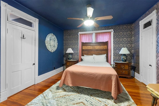 34 N Fountain Cpe, Girardeau, MO 63701 - bedroom featuring baseboards, wood finished floors, wallpapered walls, and ceiling fan