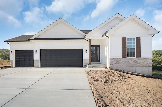 49 Back Ln Unit 49Stb, Washington, MO 63090 - modern inspired farmhouse with stone siding, a garage, and concrete driveway